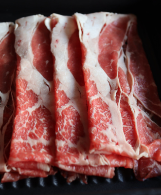 photo of marbled meats served at Black X Marketing client Momo's Paradise